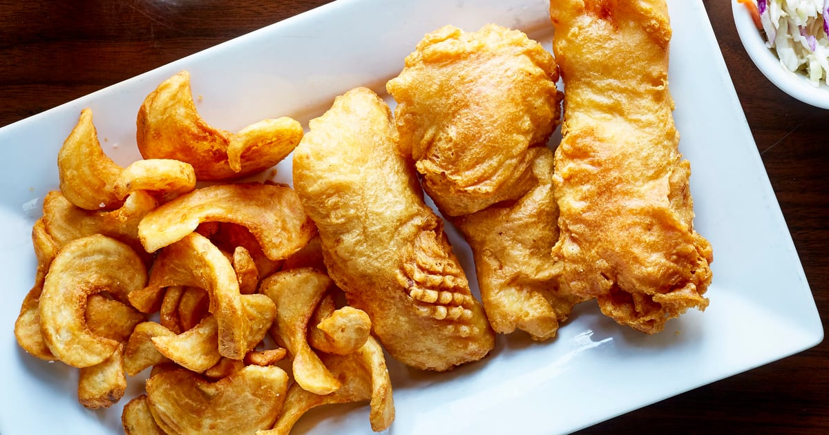 Beer Battered Cod Served With Sidewinder Fries Coleslaw Tartar Sauce