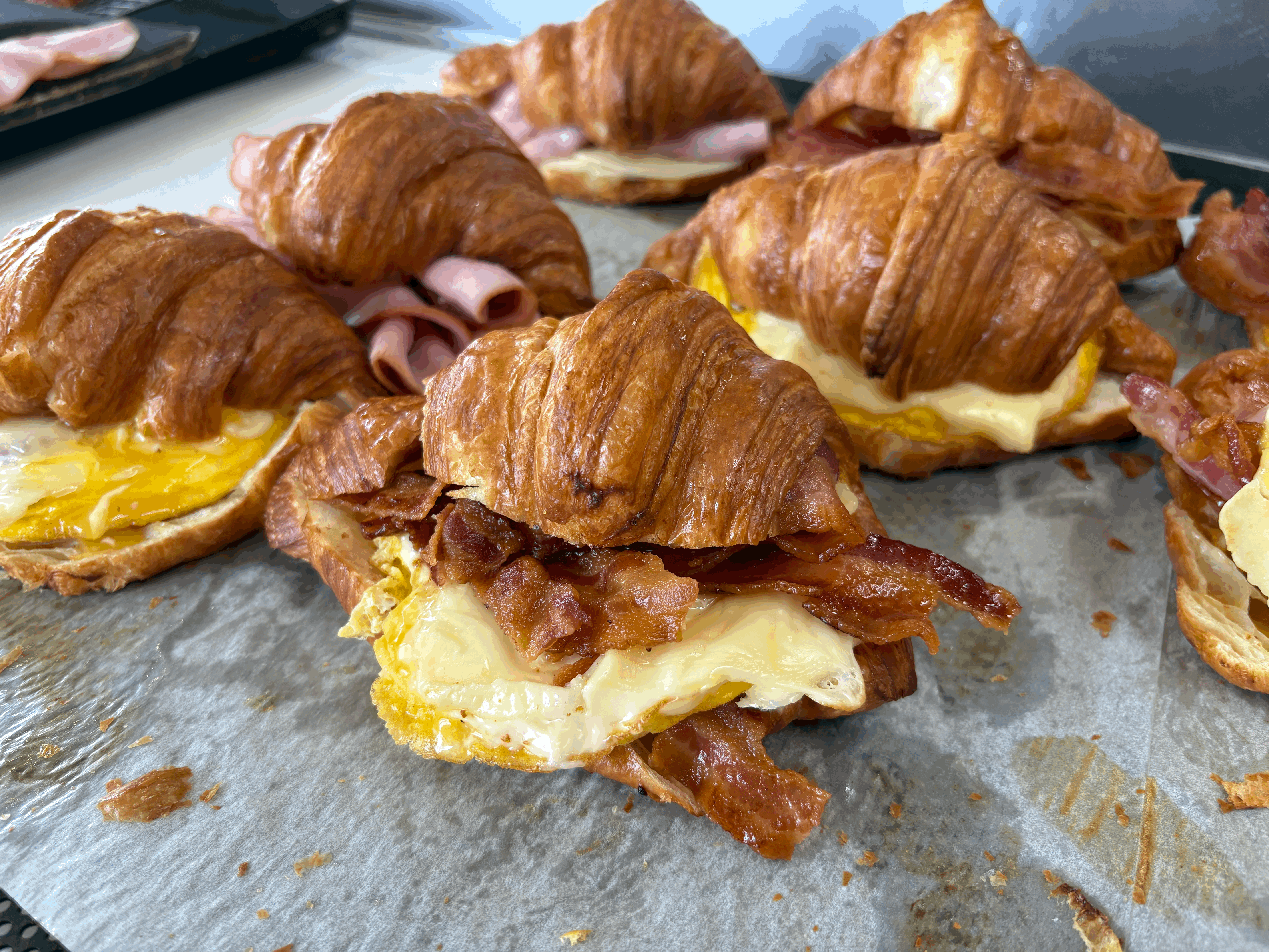 Croissant egg sandwiches, quiche pizza, pastries and fresh-squeezed orange juice.