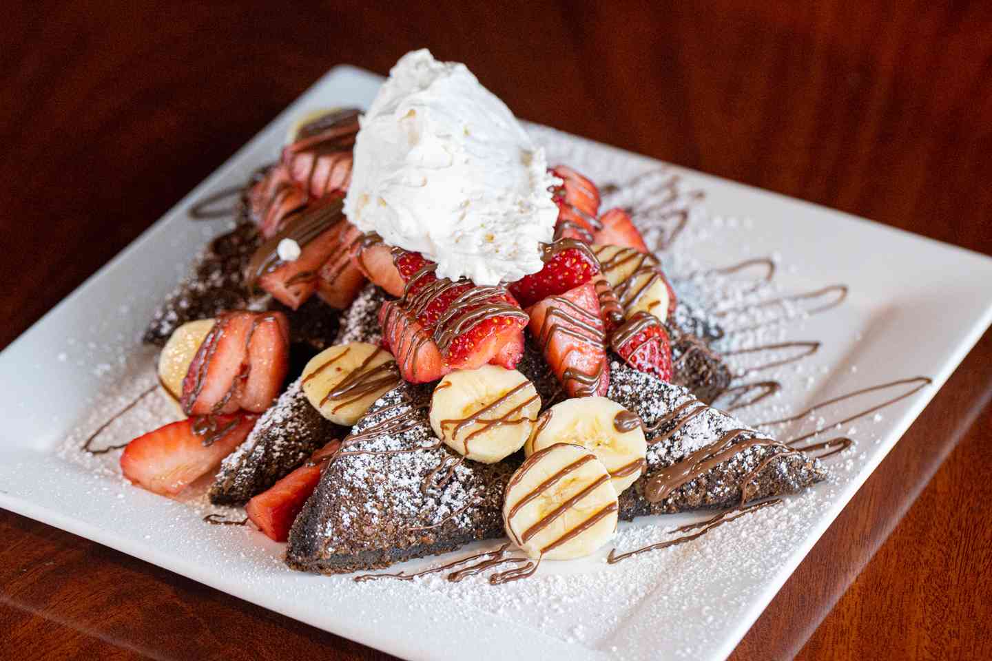 fruits topped with drizzle and creme