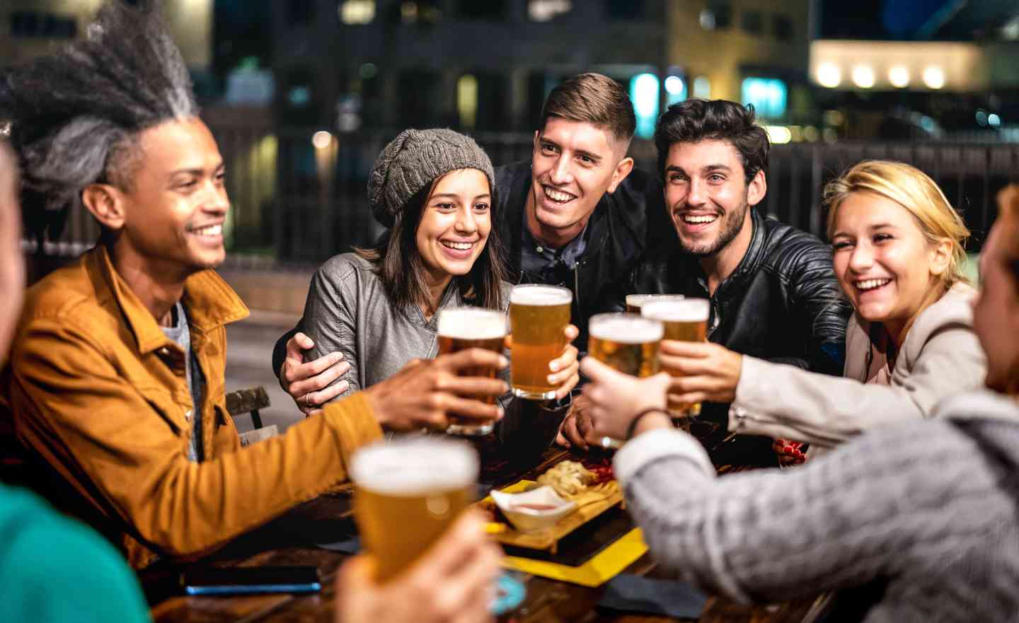 Group toasting over a variety of meals