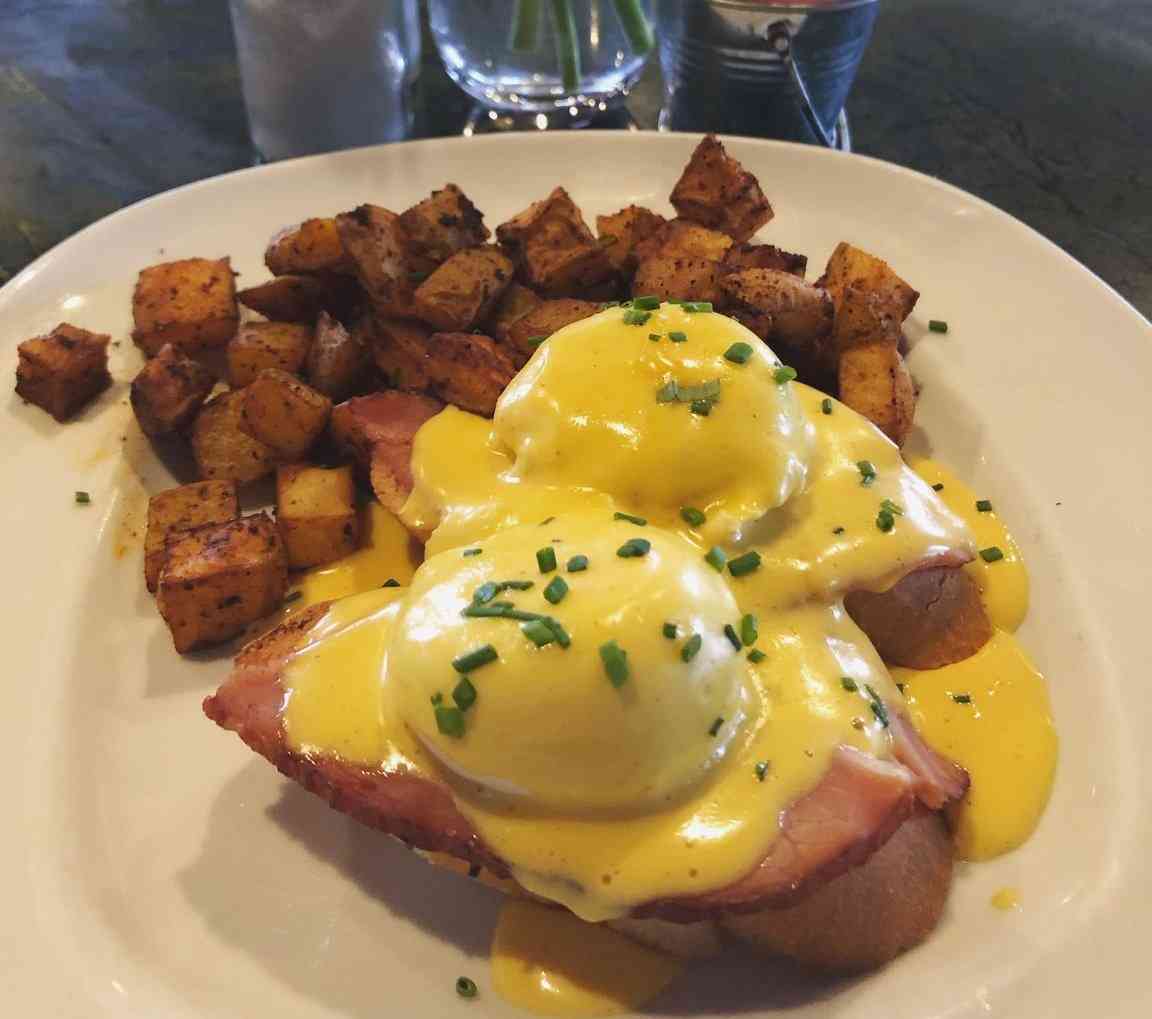 Honey Baked Ham Eggs Benedict w/ Poached Eggs, Hollandaise Sauce, and Roasted Potatoes
