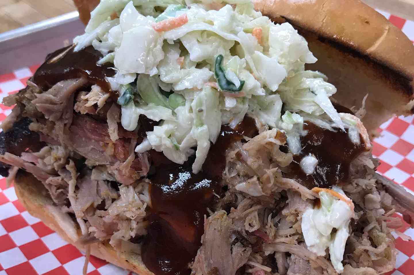 OUR SIGNATURE PULLED PORK SANDWICH