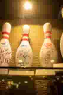 Signed bowling pins in a display case
