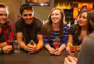 Friends enjoying conversation and drinks