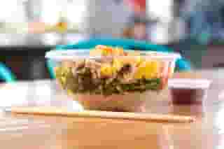 veggie bowl topped with sauce