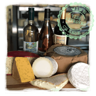 3 bottles of wine and wheels of cheese