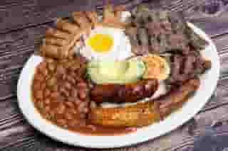 Various meats with beans, eggs and avocado
