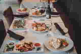 Multiple dishes and drinsk made by Mezza Luna