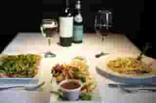 Two meals and appetizer paired with wine