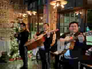 mariachis playing in butcher shop