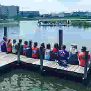 group sitting on dock