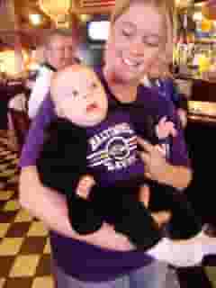 lady with baby wearing fan gear