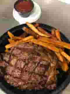 14 OZ. DOUBLE R RANCH RIB EYE PEPPERCORN STEAK & FRIES