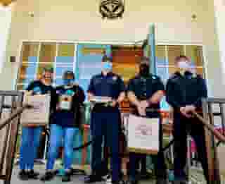3 Hawthorne Firemen with two Urth employees on Urth South Bay entrance with Urth bags and lunch boxes