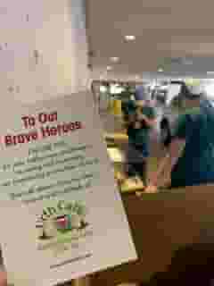 To Our Brave Heroes card with nurses and hospital entrance in background