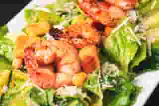 Caesar Salad topped with Grilled Shrimp