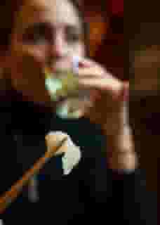 drinking sake with chopsticks