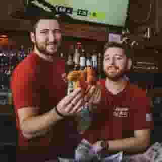 Staff holding up chicken tenders