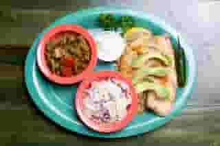 surf and turf fajitas with sides of corn, rice, and tortillas