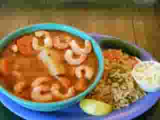 seafood soup with a side of rice