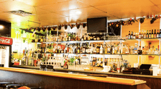 Clementina behind the bar