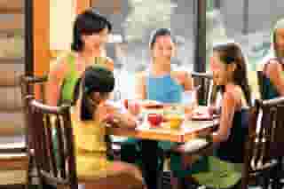 mom sitting with three daughters