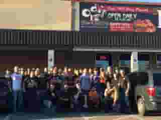 staff standing outside of the restaurant exterior