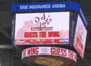 store logo and "guess the wing" shown on a scoreboard