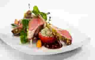Colorado Lamb Chops with stuffed tomato and vegetables
