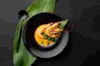 Prawn Curry: Whole prawns immersed in a yellow curry.