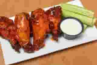 plate of wings, celery, and ranch