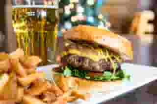 Burger with fries and a glass of beer