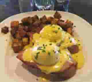 Honey Baked Ham Eggs Benedict w/ Poached Eggs, Hollandaise Sauce, and Roasted Potatoes