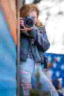 Woman taking a photograph