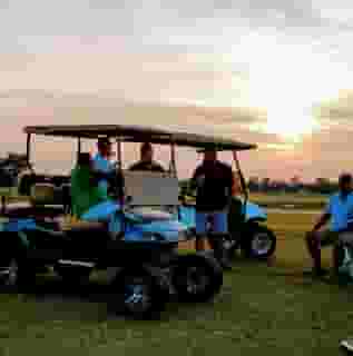 men on golf carts