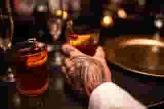Hand on cocktail
