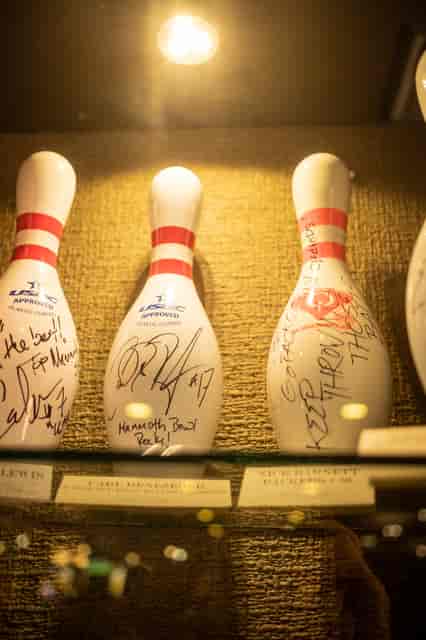 Signed bowling pins in a display case