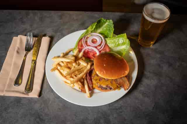 Burger with fries and salad fixings