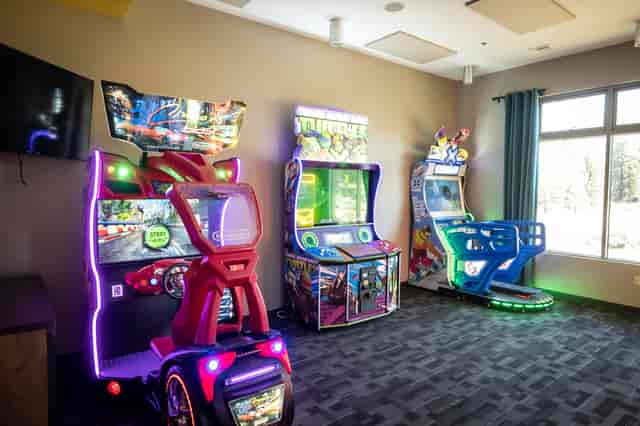 Three arcade games near bowling alley