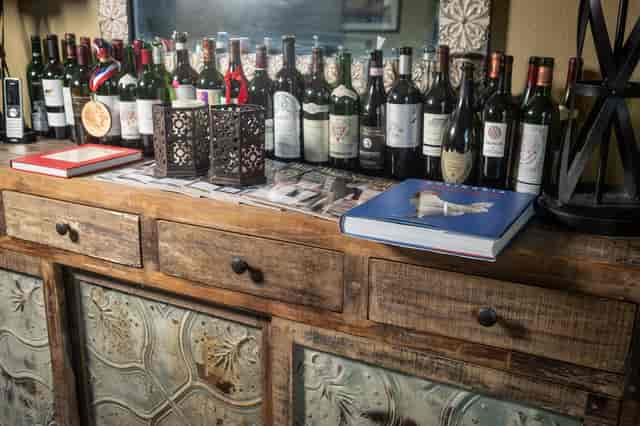 Bar with a variety of liquors and books.