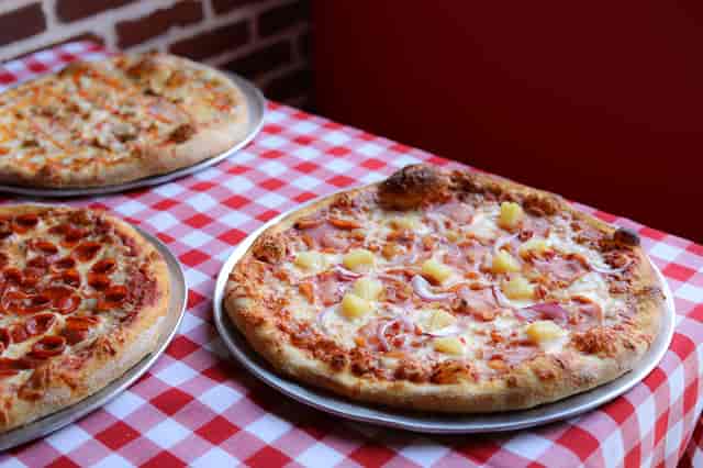 flat lay 3 pizzas