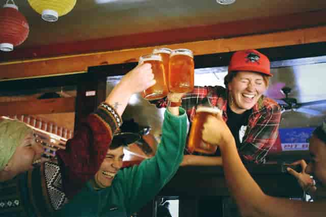 People toasting with beers