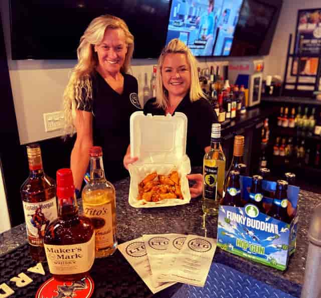Staff with a variety of meals and drinks