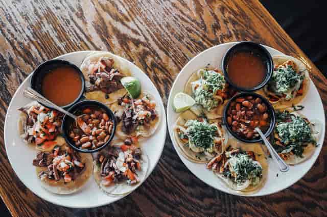 two plates of tacos