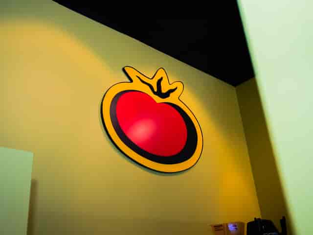 Large tomato illustration on a green wall