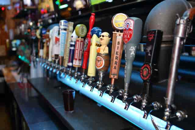 pouring beer from a tap