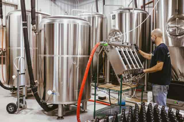 Bryan bottling barrel-aged beer