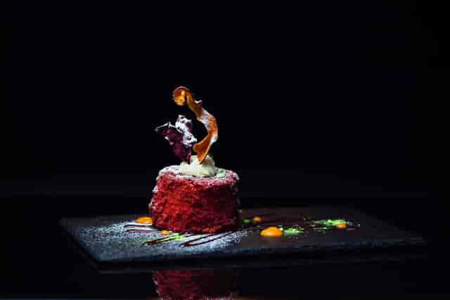 Red Velvet: Magestic, moist red velvet cake served with an assortment of dehydrated fruits and sweet sauces
