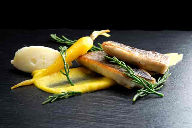 Pan-roasted seabass on yellow carrot puree