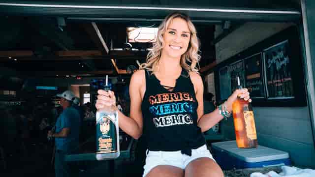 woman holding two bottles